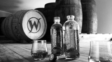 Whistler South African Style Rum rum with barrels in background